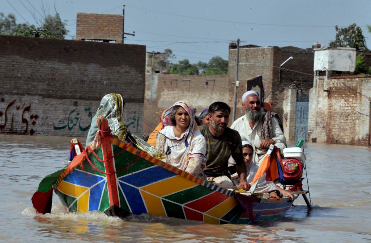 Paddling away from floods in Pakistan in 2010; flash flooding in Karachi killed more than a dozen last week. Flickr/IRIN News