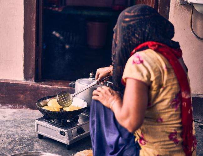 Even if a rural household cooks one or two of its daily meals in electric/induction cookstoves, it helps bring down indoor emissions. Photo by Ashwini Chaudhary/Unsplash.